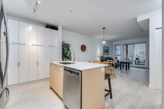 Photo 1: 106 13963 105 Boulevard in Surrey: East Newton Condo for sale in "HQ DWELL" : MLS®# R2632896